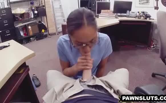 Geeky brunette in glasses sucks cock at the pawn shop